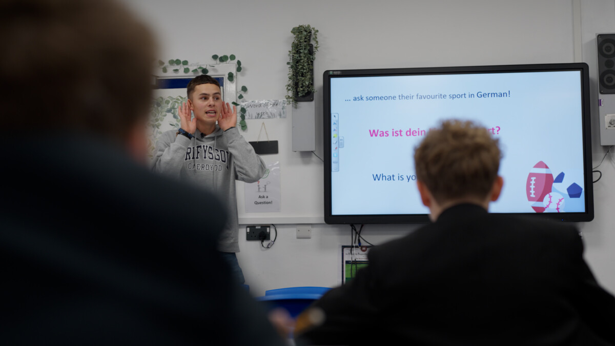 Modern Foreign Languages mentor Callum conducts a lesson to high school children