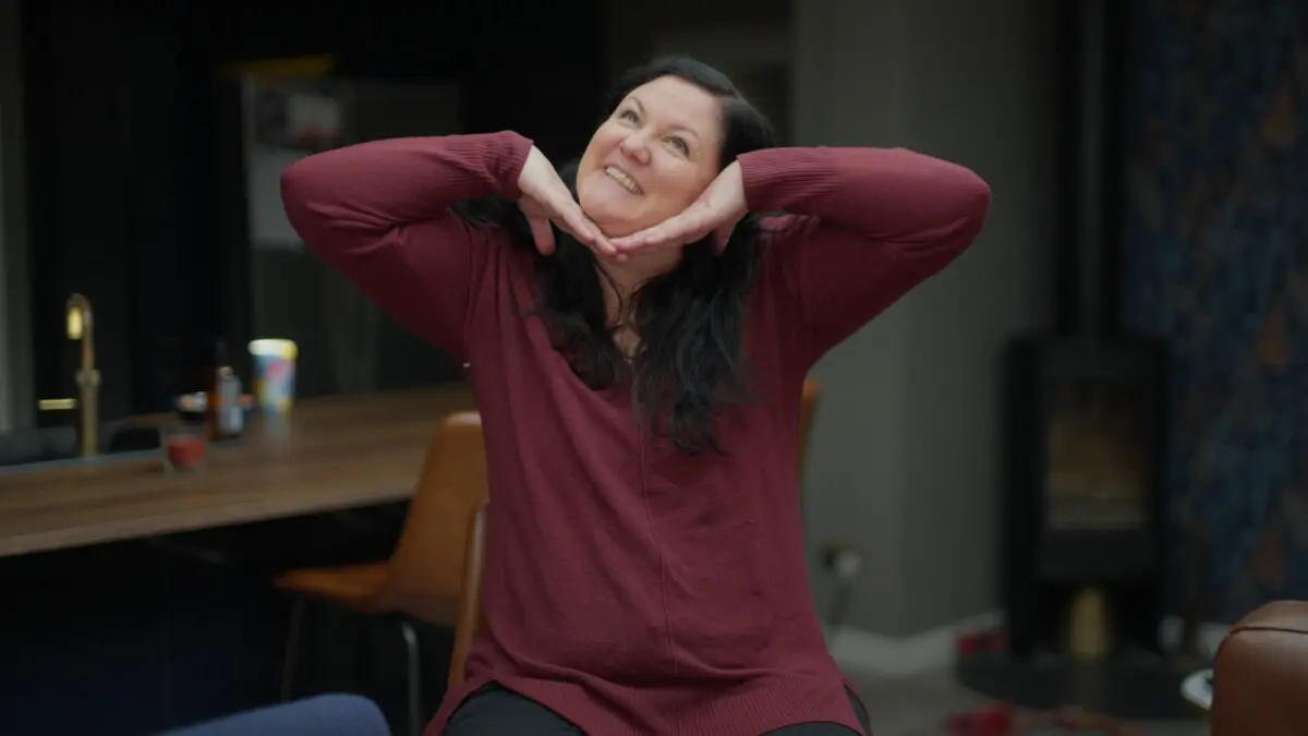 Image of a trustee, smiling and striking a pose.